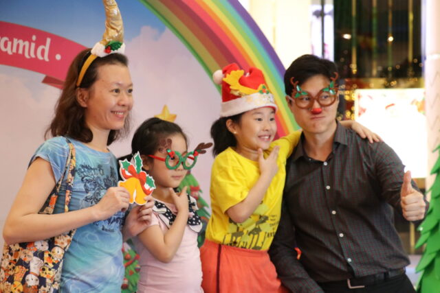 Show off your best insta pose at the Rainbow Memory Lane photobooth where you can dress up and accessorise with Christmas and unicorn props
