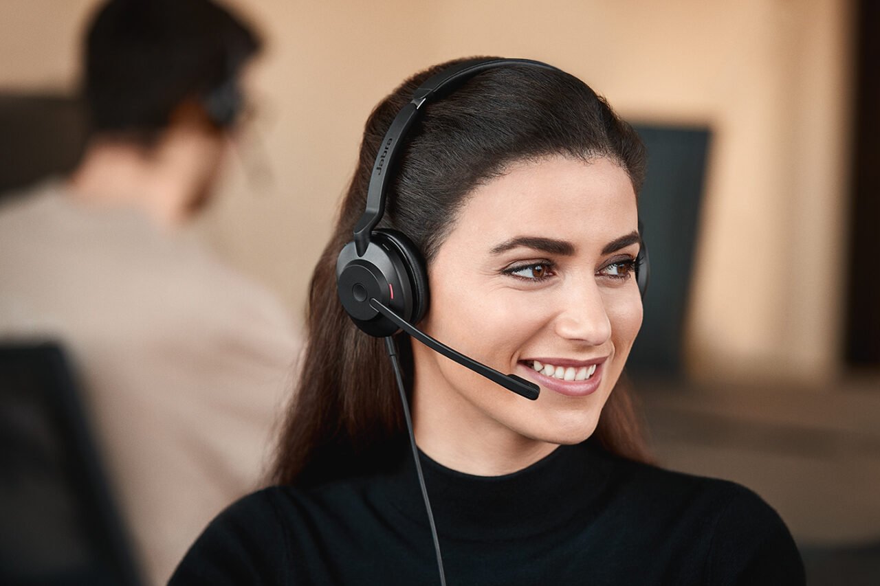 Female in office setting with Jabra Evolve2 30 headset 