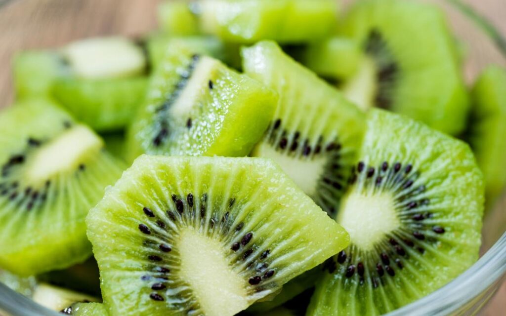 chopped kiwi in a bowl on a table