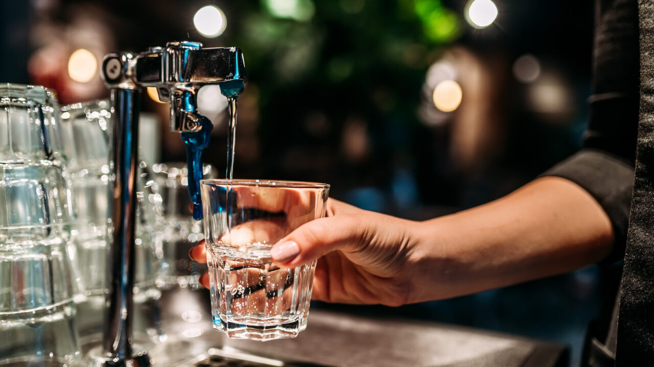 Pouring,A,Glass,Of,Water,From,A,Tap.